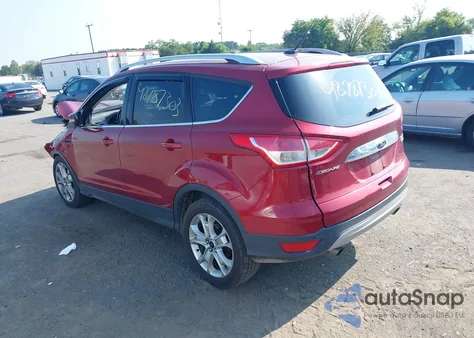 2016 Ford Escape Titanium z USA, uszkodzony, nr VIN 1FMCU0JXXGUB80020